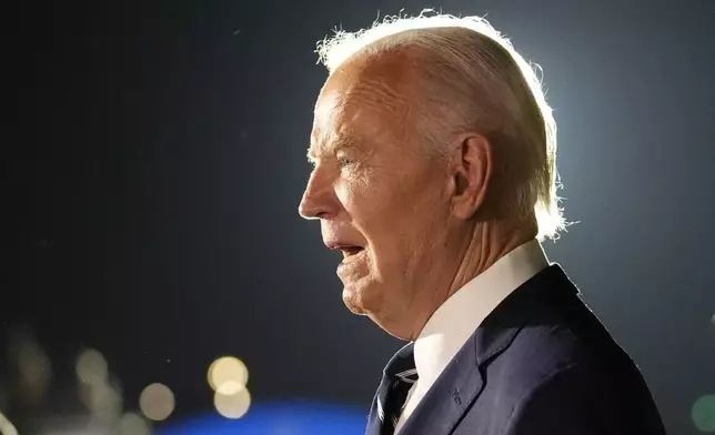 President Joe Biden speaks after greeting reporter Evan Gershkovich, Alsu Kurmasheva and Paul Whelan at Andrews Air Force Base, Md., following their release as part of a 24-person prisoner swap between Russia and the United States, Thursday, Aug. 1, 2024. (AP Photo/Alex Brandon)