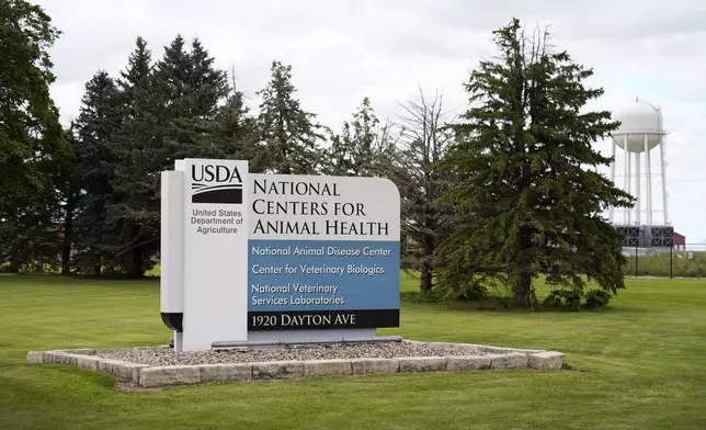 A sign stands outside of the National Centers for Animal Health campus in Ames, Iowa, on Tuesday, Aug. 6, 2024. (AP Photo/Charlie Neibergall)