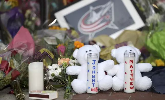 A memorial is set up by fans for Blue Jackets hockey player Johnny Gaudreau in Columbus, Ohio, Aug. 30, 2024. Gaudreau, along with his brother Matthew, was fatally struck by a motorist while riding his bicycle on Thursday. (AP Photo/Joe Maiorana)