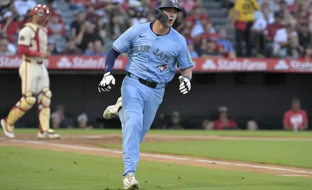 Toronto Blue Jays' Will Wagner runs to first after hitting an RBI single during the third inning of a baseball game against the Los Angeles Angels, Monday, Aug. 12, 2024, in Anaheim, Calif. (AP Photo/Jayne-Kamin-Oncea)