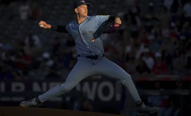 Toronto Blue Jays' Bowden Francis delivers to the plate during the first inning of a baseball game against the Los Angeles Angels, Monday, Aug. 12, 2024, in Anaheim, Calif. (AP Photo/Jayne-Kamin-Oncea)