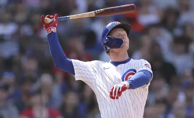 Chicago Cubs' Pete Crow-Armstrong pops out to Toronto Blue Jays' Vladimir Guerrero Jr. during the seventh inning of a baseball game against the Sunday, Aug. 18, 2024, in Chicago. (AP Photo/Melissa Tamez)