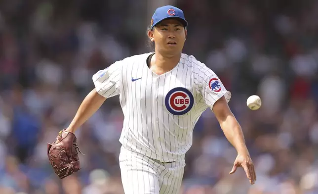 Chicago Cubs' Shota Imanaga flips the ball to first base for an out during the fifth inning of a baseball game against the Toronto Blue Jays, Sunday, Aug. 18, 2024, in Chicago. (AP Photo/Melissa Tamez)