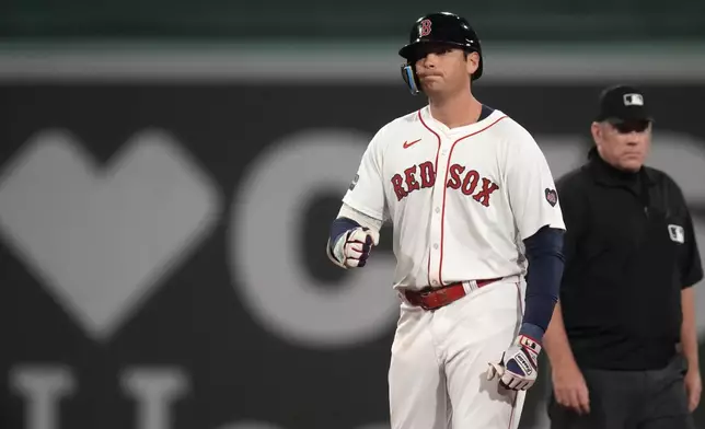 Boston Red Sox's Triston Casas pumps his fist after hitting an RBI double during the fifth inning of a baseball game against the Toronto Blue Jays at Fenway Park, Tuesday, Aug. 27, 2024, in Boston. (AP Photo/Charles Krupa)