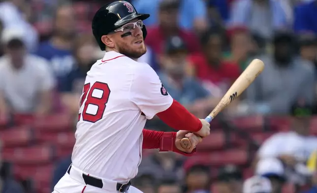 Boston Red Sox catcher Danny Jansen watches his line out during the resumption of the second inning of a baseball game against the Toronto Blue Jays, which was delayed due to rain in June, against the Toronto Blue Jays at Fenway Park, Monday, Aug. 26, 2024, in Boston. Jansen, who was traded by the Blue Jays to the Red Sox on July 27th, became the first major league player to appear in the same game for both teams. (AP Photo/Charles Krupa)