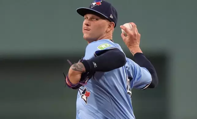 Toronto Blue Jays' Bowden Francis winds up for a pitch to a Boston Red Sox batter in the first inning of a baseball game Thursday, Aug. 29, 2024, in Boston. (AP Photo/Steven Senne)