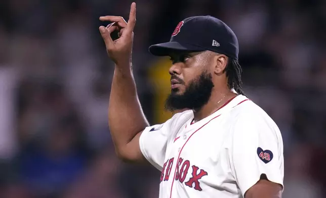 Boston Red Sox pitcher Kenley Jansen celebrates after defeating the Toronto Blue Jays 3-0 following a baseball game at Fenway Park, Wednesday, Aug. 28, 2024, in Boston. (AP Photo/Charles Krupa)