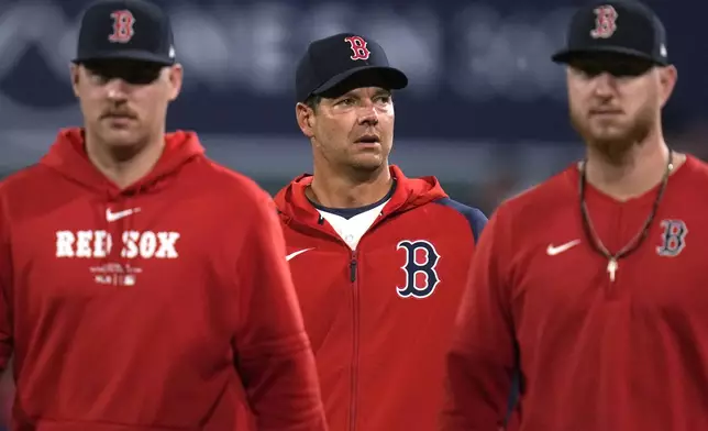 Boston Red Sox pitcher Rich Hill, center, walks from the bullpen after a baseball game against the Toronto Blue Jays at Fenway Park, Tuesday, Aug. 27, 2024, in Boston. (AP Photo/Charles Krupa)