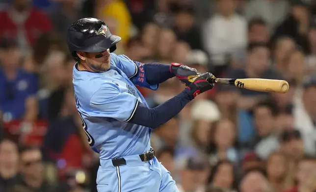 Toronto Blue Jays' Ernie Clement hits a one-run double in the sixth inning of a baseball game against the Boston Red Sox, Thursday, Aug. 29, 2024, in Boston. (AP Photo/Steven Senne)