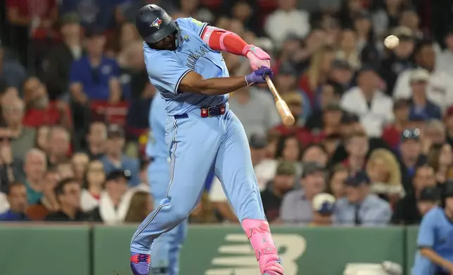 Toronto Blue Jays' Vladimir Guerrero Jr. hits a one-run double in the third inning of a baseball game against the Boston Red Sox, Thursday, Aug. 29, 2024, in Boston. (AP Photo/Steven Senne)