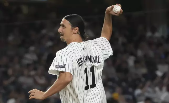 Retired professional soccer player Zlatan Ibrahimović throws the first pitch before a baseball game between the New York Yankees and the Toronto Blue Jays, Friday, Aug. 2, 2024, in New York. (AP Photo/Pamela Smith)