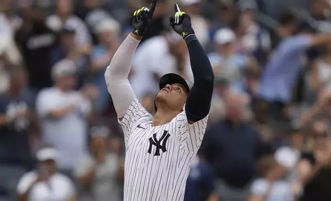 New York Yankees' Juan Soto reacts after hitting a solo home run during the seventh inning of a baseball game against the Toronto Blue Jays at Yankee Stadium, Sunday, Aug. 4, 2024, in New York. (AP Photo/Seth Wenig)