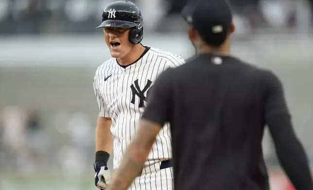 New York Yankees' DJ LeMahieu reacts after hitting a walk-off RBI single during the tenth inning of a baseball game against the Toronto Blue Jays at Yankee Stadium Sunday, Aug. 4, 2024, in New York. (AP Photo/Seth Wenig)