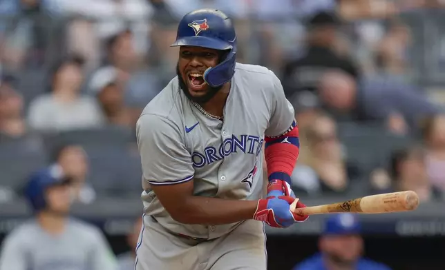 Toronto Blue Jays' Vladimir Guerrero Jr. reacts as he flies out during the eighth inning of a baseball game against the New York Yankees at Yankee Stadium, Sunday, Aug. 4, 2024, in New York. (AP Photo/Seth Wenig)