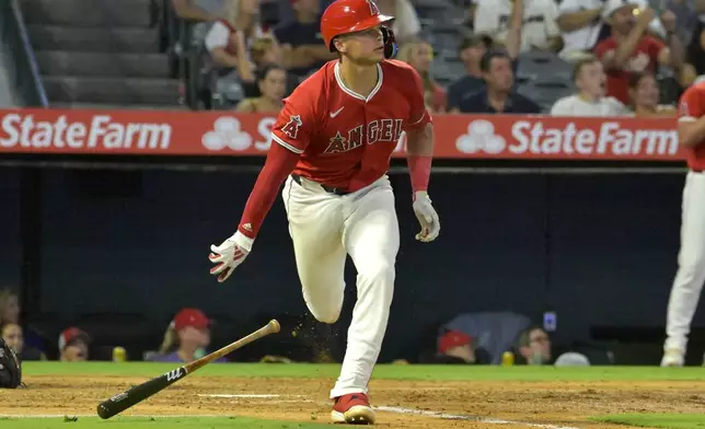 Los Angeles Angels' Logan O'Hoppe watches the flight of the ball on a two-run home run in the fourth inning of a baseball game against the Atlanta Braves, Friday, Aug. 16, 2024, in Anaheim, Calif. (AP Photo/Jayne Kamin-Oncea)