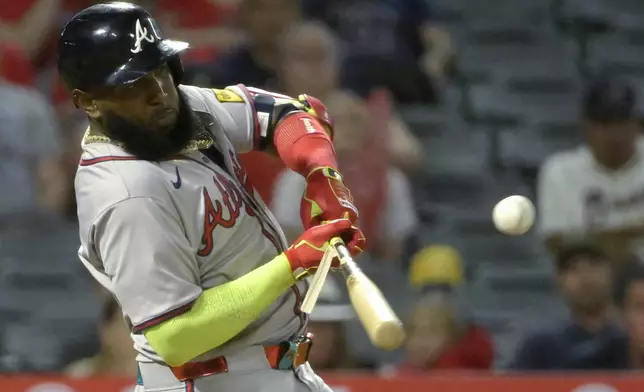 Atlanta Braves' Marcell Ozuna breaks his bat on a single in the eighth inning against the Los Angeles Angels in a baseball game Friday, Aug. 16, 2024, in Anaheim, Calif. (AP Photo/Jayne Kamin-Oncea)