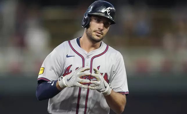 Atlanta Braves' Matt Olson celebrates while running the bases after hitting a three-run home run during the first inning of a baseball game against the Minnesota Twins, Monday, Aug. 26, 2024, in Minneapolis. (AP Photo/Abbie Parr)