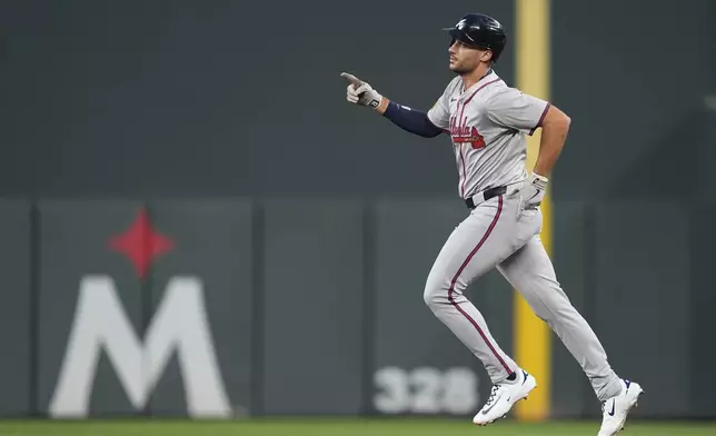 Atlanta Braves' Matt Olson runs the bases after hitting a three-run home run during the first inning of a baseball game against the Minnesota Twins, Monday, Aug. 26, 2024, in Minneapolis. (AP Photo/Abbie Parr)