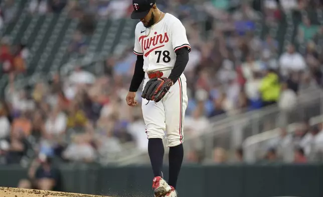 Minnesota Twins starting pitcher Simeon Woods Richardson (78) stands on the mound after a 2-run home run by Atlanta Braves' Michael Harris II during the first inning of a baseball game Tuesday, Aug. 27, 2024, in Minneapolis. (AP Photo/Abbie Parr)