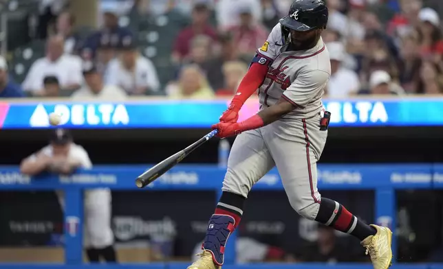 Atlanta Braves' Michael Harris II hits a 2-run home run during the first inning of a baseball game against the Minnesota Twins, Tuesday, Aug. 27, 2024, in Minneapolis. (AP Photo/Abbie Parr)