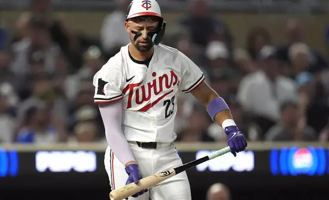 Minnesota Twins' Royce Lewis reacts after striking out to end the bottom of the fifth inning of a baseball game against the Atlanta Braves, Tuesday, Aug. 27, 2024, in Minneapolis. (AP Photo/Abbie Parr)