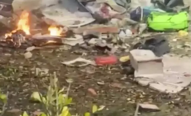 This frame grab from video shows wreckage from a plane that crashed by a home in Vinhedo, Sao Paulo state, Brazil, Friday, Aug. 9, 2024. (Felipe Magalhaes Filho via AP)