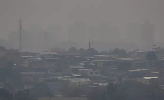 Smoke from wildfires fills the air in Manaus, Amazonas state, Brazil, Tuesday, Aug. 27, 2024. (AP Photo/Edmar Barros)