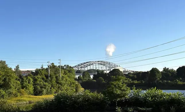 The Piscataqua River Bridge is shown in Portsmouth, N.H., after a man connected to a homicide was fatally shot by police and an 8-year-old child was found shot to death in the man’s car on the bridge that connects New Hampshire to Maine, Thursday, Aug. 29, 2024. An 8-year-old child was found shot to death in the man's car, the attorney general's office said Thursday. (AP Photo/Caleb Jones)