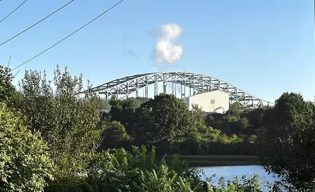 The Piscataqua River Bridge is shown in Portsmouth, N.H. after a man connected to a homicide was fatally shot by police and an 8-year-old child was found shot to death in the man’s car on the bridge that connects New Hampshire to Maine, Thursday, Aug. 29, 2024. An 8-year-old child was found shot to death in the man's car, the attorney general's office said Thursday. (AP Photo/Caleb Jones)