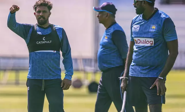 Sri Lanka's Kusal Mendis, left, attends a nets session at Lord's, London, Wednesday Aug. 28, 2024. (Steven Paston/PA via AP)