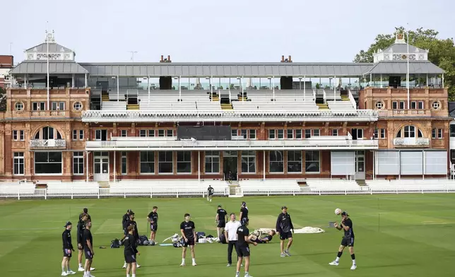 England players warm up playing football during a nets session at Lord's, in London, Tuesday, Aug. 27, 2024, ahead of their test cricket match against Sri Lanka on Thursday. (Steven Paston/PA via AP)