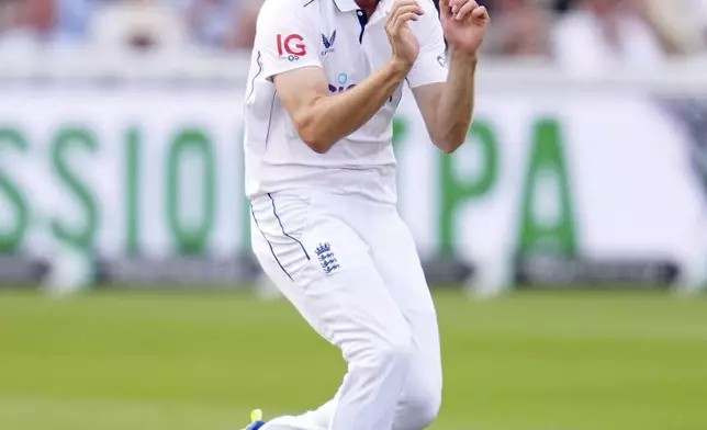 England's Olly Stone celebrates bowling out Sri Lanka's Dimuth Karunaratne during day two of the second Rothesay Men's Test cricket match between England and Sri Lanka at Lord's, London, Friday, Aug. 30, 2024. (John Walton/PA via AP)