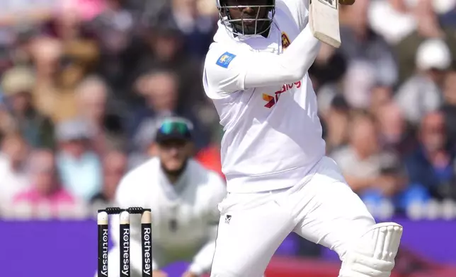 Sri Lanka's Dinesh Chandimal bats on day three of the First Test match between England and Sri Lanka at Emirates Old Trafford, Manchester, England, Friday Aug. 23, 2024. (Nick Potts/PA via AP)