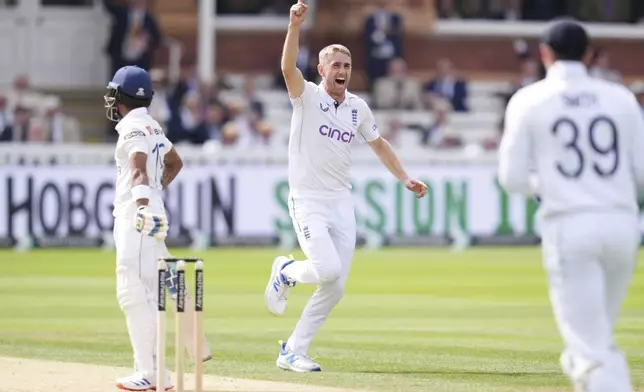 England's Olly Stone celebrates taking the wicket of Sri Lanka's Pathum Nissanka during day two of the second Rothesay Men's Test cricket match between England and Sri Lanka at Lord's, London, Friday, Aug. 30, 2024. (John Walton/PA via AP)