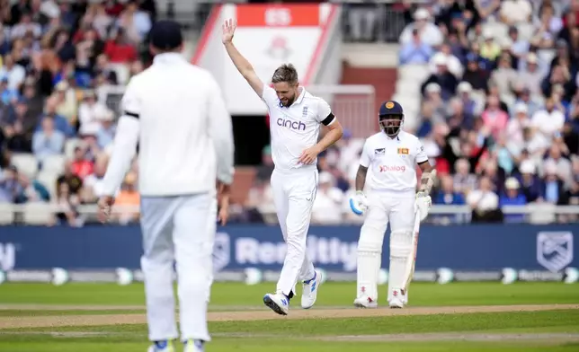 England's Chris Woakes celebrates taking the wicket of Sri Lanka's Angelo Mathews during day one of the First Rothesay Test match at Emirates Old Trafford, Manchester, England, Wednesday, August 21, 2024. (Nick Potts/PA via AP)