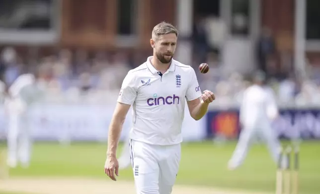 England's Chris Woakes bowls during day two of the second Rothesay Men's Test cricket match between England and Sri Lanka at Lord's, London, Friday, Aug. 30, 2024. (John Walton/PA via AP)