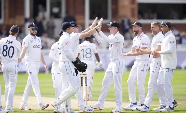 England's Olly Stone celebrates taking the wicket of Sri Lanka's Pathum Nissanka during day two of the second Rothesay Men's Test cricket match between England and Sri Lanka at Lord's, London, Friday, Aug. 30, 2024. (John Walton/PA via AP)