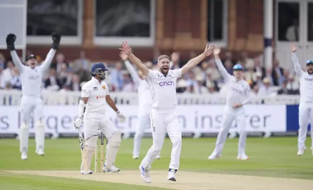 England's Chris Woakes unsuccessful appeal for the wicket of Sri Lanka's Dimuth Karunaratne during day two of the second Rothesay Men's Test cricket match between England and Sri Lanka at Lord's, London, Friday, Aug. 30, 2024. (John Walton/PA via AP)