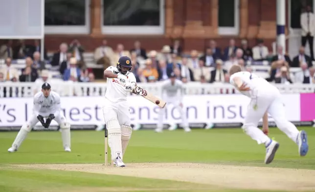 England's Olly Stone bowls to Sri Lanka's Kamindu Mendis during day two of the second Rothesay Men's Test cricket match between England and Sri Lanka at Lord's, London, Friday, Aug. 30, 2024. (John Walton/PA via AP)