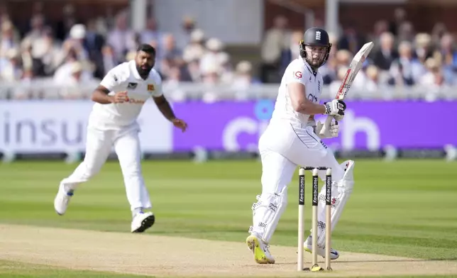 England's Gus Atkinson bats during day two of the second Rothesay Men's Test cricket match between England and Sri Lanka at Lord's, London, Friday, Aug. 30, 2024. (John Walton/PA via AP)