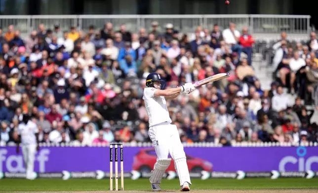 England's Matthew Potts is caught out by Sri Lanka's Kusal Mendis to end England's first innings on day three of the First Test match between England and Sri Lanka at Emirates Old Trafford, Manchester, England, Friday Aug. 23, 2024. (Nick Potts/PA via AP)