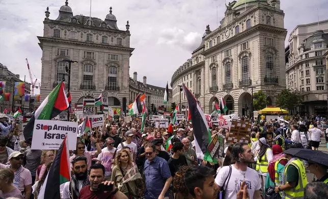 Demonstrators march in support of Palestinians, in London, Saturday, Aug. 3, 2024. (AP Photo/Alberto Pezzali)