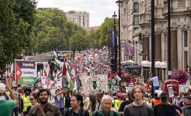 Demonstrators march in support of Palestinians, in London, Saturday, Aug. 3, 2024. (AP Photo/Alberto Pezzali)