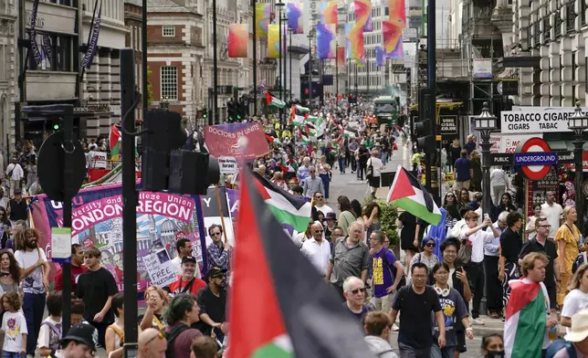 Demonstrators march in support of Palestinians, in London, Saturday, Aug. 3, 2024. (AP Photo/Alberto Pezzali)