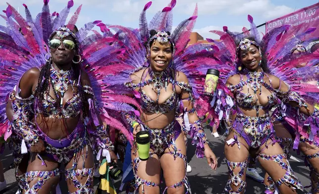 Dancers prepare to take part in the Notting Hill Carnival celebration in west London, Monday Aug. 26, 2024. (Lucy North/PA via AP)