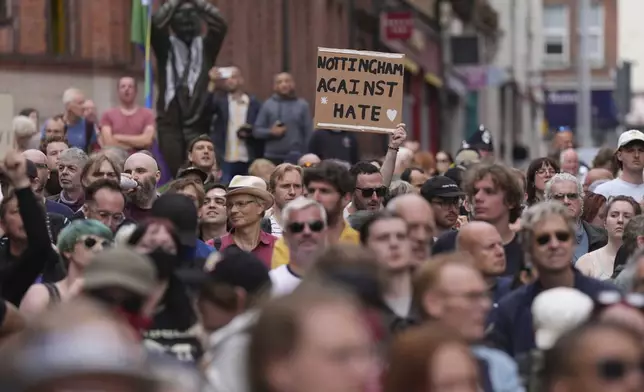 Counter demonstration in Nottingham Market Square, England, Saturday Aug. 3, 2024, against people protesting in the same location in following the stabbing attacks on Monday in Southport, in which three young children were killed. (Jacob King/PA via AP)