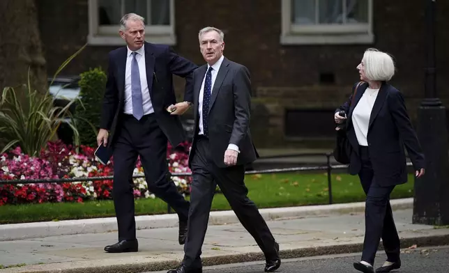 Chief of the Defence Staff Admiral Sir Tony Radakin, centre, arrives at Downing Street, where Prime Minister Sir Keir Starmer is chairing a meeting of the Government's emergency Cobra committee following ongoing unrest across parts of the country, in London, Monday Aug. 5, 2024. (Aaron Chown/PA via AP)