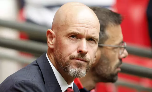 Manchester United manager Erik ten Hag watches his team during the FA Community Shield final soccer match between Manchester City and Manchester United at Wembley Stadium in London, Saturday, Aug. 10, 2024. (AP Photo/David Cliff)