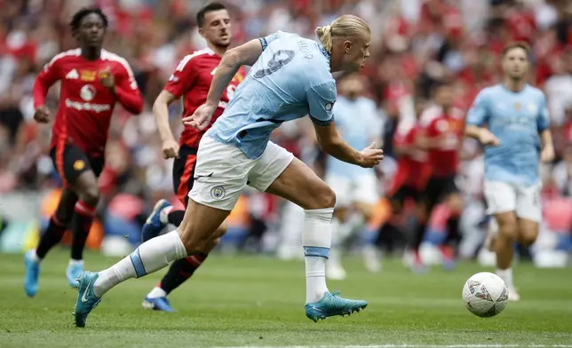 Manchester City forward Erling Haland shoots during the FA Community Shield final soccer match between Manchester City and Manchester United at Wembley Stadium in London, Saturday, Aug. 10, 2024. (AP Photo/David Cliff)