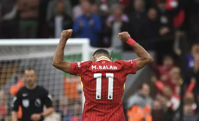 Liverpool's Mohamed Salah celebrates after scoring his side's second goal during the English Premier League soccer match between Liverpool and Brentford at Anfield Stadium, Liverpool, England, Sunday, Aug. 25, 2024. (AP Photo/Rui Vieira)